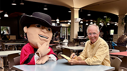 GCC Gaucho being interviewed with John Heckenlaible, GCC PR & Marketing Director.