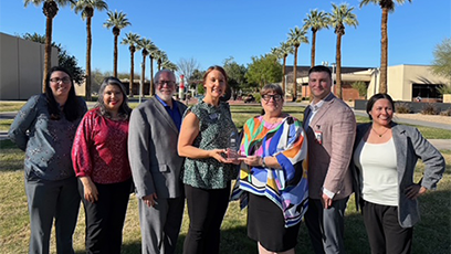 GCC employees receiving the Shining Star Award from Peoria Chamber CEO and President Rhonda Carlson.