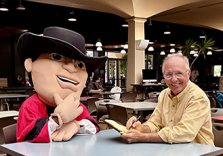 GCC Gaucho being interviewed with John Heckenlaible, GCC PR & Marketing Director.